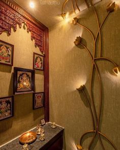 an ornately decorated bathroom with paintings on the wall and decorative lights hanging from the ceiling