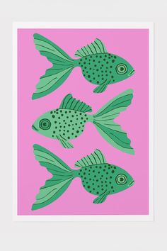 three green fish on a pink background