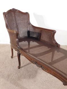 an old wooden bench sitting on top of a carpeted floor