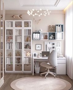 a home office with lots of white furniture and shelves filled with books, papers, and other items