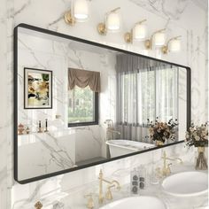 a bathroom with two sinks and a large mirror on the wall above it is shown