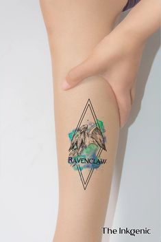 a woman's leg with a tattoo on it and the words ravenclaw