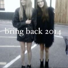 two young women standing next to each other in front of a building with the words bring back 2014