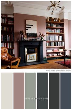 a living room with bookshelves, fireplace and leather chair in the middle of it