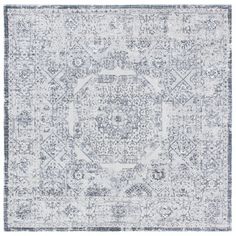 a gray and white rug with an intricate design on the middle, in front of a white background