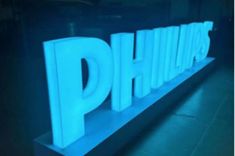 the word phillips is lit up in blue light