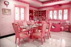 a pink dining room with hello kitty decorations