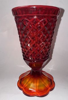 Add a touch of vintage elegance to your home decor with this beautiful 7.75” Amberina Indiana Glass Pedestal Vase. The vase features a stunning diamond pattern and is made of high-quality glass material. Whether you’re looking for a vase to display your favorite flowers or simply want to add a unique touch to your home, this vase is the perfect choice. This original, non-reproduction vase is ideal for all occasions and will make a great addition to any collection. The vase was made in the United States and is of exceptional quality. With its elegant design and timeless appeal, this vase is sure to become a cherished item in your home decor. Pedestal Vase, Glass Pedestal, Vintage Elegance, Indiana Glass, Favorite Flowers, Glass Material, Diamond Pattern, Indiana, Elegant Design