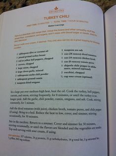 an open book with instructions on how to cook turkey chilli and what to put in it