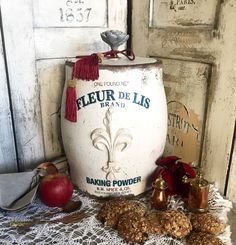 an old fashioned fleur de lis blender next to some apples and other items