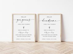 two framed wedding signs on the floor in front of a white wall with chevron herringbones