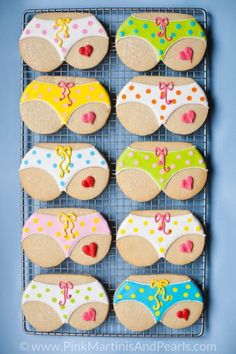 decorated cookies are arranged on a cooling rack for the kids to use in their swimsuits