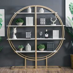 a book shelf with plants and books on it