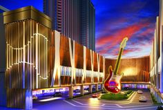 a guitar statue in front of a building