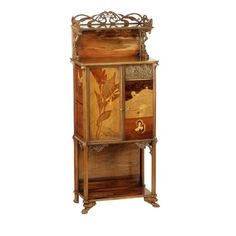 an ornate wooden cabinet with floral designs on it