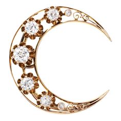 Elaborate antique Victorian crescent moon pendant/brooch (circa 1880s to 1900s) crafted in 14 karat yellow gold.   Old mine cut diamonds graduate in size from 0.02 to 0.30 carat and total an estimated 0.75 carats (estimated at J-K color and VS2-SI2 clarity)  Set into a classic crescent moon motif, the old mine cut diamonds glimmer, arranged to create a celestial effect, evoking a shimmering night sky. Also wearable as a brooch, the versatile piece is great worn on a lapel or cuff in addition to Victorian Diamond Pendant, Masonic Jewelry, Star Celestial, Russian Jewelry, Bijoux Art Nouveau, Pendant Brooch, Antique Jewelry Necklace, Crescent Moon Pendant, Moon Pendant Necklace