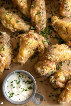 chicken wings with ranch dressing on the side