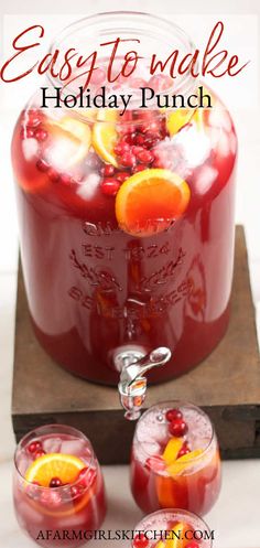 three glasses filled with cranberry punch on top of a cutting board