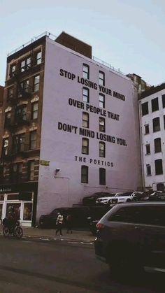 an advertisement on the side of a building that says stop losing your mind over people that don't mind losing you