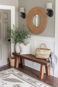 a wooden bench sitting in front of a door with a basket on top of it