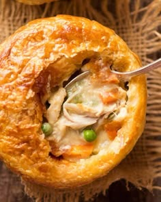 chicken pot pie with a spoon in it