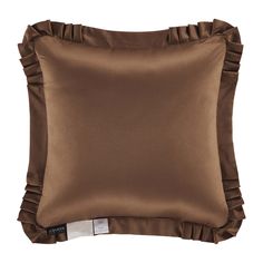 a brown pillow with ruffles on the front and back of it's cover