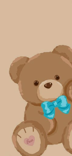 a brown teddy bear with a blue bow on it's neck sitting in front of a beige background