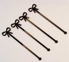 four pairs of scissors with bows on them