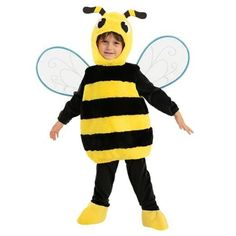 a little boy dressed in a bee costume