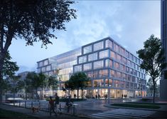 an office building with many windows and people walking on the sidewalk in front of it