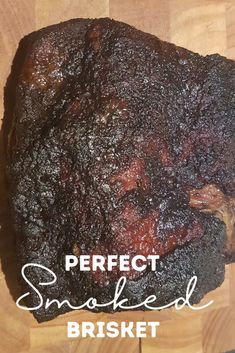 a piece of smoked brisket sitting on top of a wooden cutting board with the words perfect smoked brisket