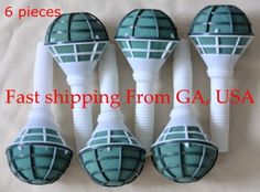 four white and green plastic golf head covers on top of each other, with the same pattern