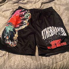 This Is A Dope Pair Of Graphic Mesh Shorts Comfy But Ran Small Tag Says Xl But Fit Like A Large Never Worn But Took Tags Off Black Sports Pants For Summer, Black Graphic Print Bottoms For Spring, Spring Black Bottoms With Graphic Print, Black Bottoms With Letter Print, Short Length, Black Bottoms With Letter Print In Short Length, Black Bottoms With Letter Print, Black Bottoms With Letter Print Short Length, Black Letter Print Shorts For Spring, Black Short Length Bottoms With Letter Print