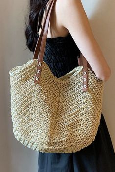 Escape to summer paradise with this breezy woven tote bag, hand-crafted from natural raffia straw. Its generous size easily fits all your beach essentials, while the comfortable single shoulder strap with a stylish brown leather accent ensures effortless carrying. The timeless beige color and unique style add a touch of bohemian flair to any outfit. Pack picnics, stroll the boardwalk, or relax by the waves - this eco-friendly tote is your ultimate summer companion. Product information : Texture: grass Backpack mode: one shoulder Shoulder strap style: single Color category: beige Lining material: polyester Size Information: Size: Upper opening: 40CM Middle height: 27CM Bag height: 32CM (excluding the handle) Summer Paradise, Straw Tote Bag, Woven Tote Bag, Straw Tote, Beach Ready, Beach Essentials, Crochet Handbags, Woven Bag, Beige Color