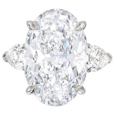 an oval diamond ring with three pear shaped diamonds