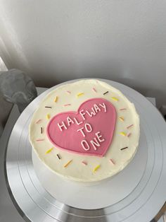 a cake that has been decorated with the words halfway to one