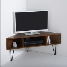 an entertainment center with a flat screen tv on top