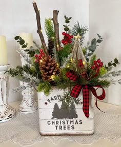 a christmas planter with pine cones and evergreens