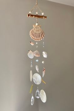 a wind chime with seashells hanging from it