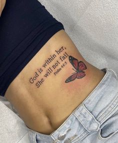 a woman with a butterfly tattoo on her stomach saying god is within her she will not fail