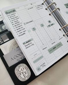 an open planner is sitting on a table