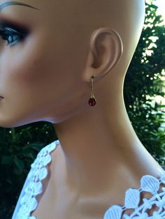 "Genuine Garnet earnings, burgundy gold dangles, dark red teardrop jewelry, January birthstone. Handcrafted with natural red Garnet Stones. Petite, minimalistic and lightweight. Real Untreated Garnet stones (8 x 6 mm) faceted teardrop shape gems wire wrapped and suspended on leverbacks. Length is about 1\" long. Each pair of gems is unique and one of a kind, they are untreated and natural stones, expect some imperfections. These beautiful earrings will be a nice gift for a female that like moder Red Dangle Teardrop Earrings For Formal Occasions, Classic Dangle Drop Earrings As Gift, Red Birthstone Jewelry For Party, Red Teardrop Dangle Earrings For Formal Occasions, Elegant Cranberry Jewelry For Gift, Dainty Red Jewelry For Formal Occasions, Red Dainty Jewelry For Formal Occasions, Dainty Red Formal Jewelry, Elegant Handmade Drop Earrings As Gift