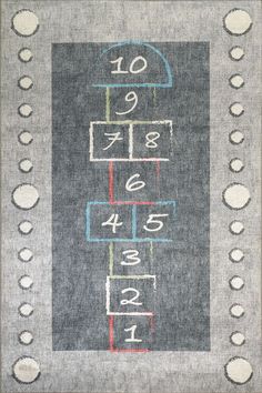 an area rug with numbers and squares on it