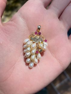 Total Weight: 7.1 grams Length: 34.2m (with bail) Width: 2.3cm Pearl: 6x3.4mm Ruby: 2.5mm Condition: In great condition showing little wear with no damage. All gold has been thoroughly checked with an Olympus XRF spectrometer. It is guaranteed 14k gold.  All our jewelry is properly washed and disinfected to ensure customers get clean items with every order.  Returns accepted but may be subjected to a restock fee.  Please message with any questions:) Fine Jewelry Pear-shaped Multi-stone, Exquisite Multi-stone Pear-shaped Jewelry, Exquisite Pear-shaped Multi-stone Jewelry, Yellow Gold Briolette Jewelry For Anniversary, Exquisite Cluster Jewelry Gift, Exquisite 14k Stamped White Gold Jewelry, Heirloom Jewelry With High Luster For Gifts, Pear-shaped Multi-stone Formal Jewelry, Heirloom Style High Luster Jewelry For Gifts