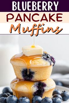 blueberry pancake muffins stacked on top of each other with butter and blueberries