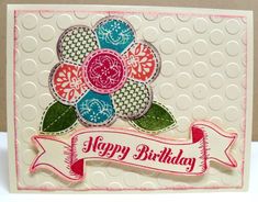 a happy birthday card with a flower on it