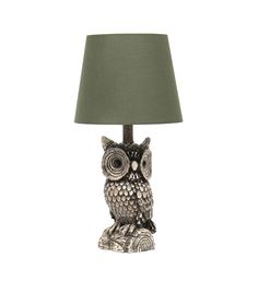 an owl lamp with a green shade on it