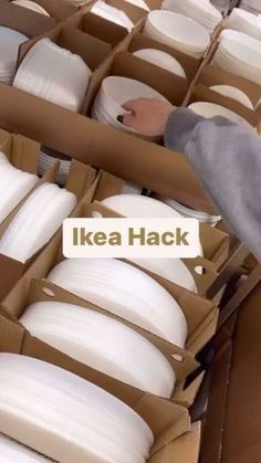 an image of a box filled with lots of white plates