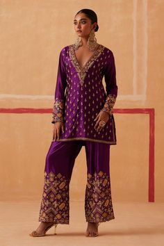 Plum kurta with zardozi, bead, thread, cutdana embroidery in floral applique pattern. Paired with pant. Components: 2 Pattern: Embroidery Type Of Work: Zardozi, sequin, bead, thread, cutdana, floral Neckline: Plunge V neck Sleeve Type: Full sleeves Fabric: Pure Silk Color: Purple Other Details:  Scallop border Side slit kurta Length: Kurta: 30 inches Pant: 40 inches Occasion: Sangeet - Aza Fashions Festive Indian Wear, Sureena Chowdhri Suits, Sureena Chowdhri, Cutdana Embroidery, Ethnic Wears, Egypt Jewelry, Indian Wedding Gowns, Kurti Embroidery, Scallop Border