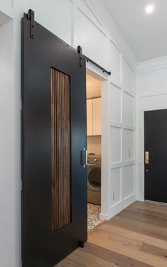 an open black door in a white room